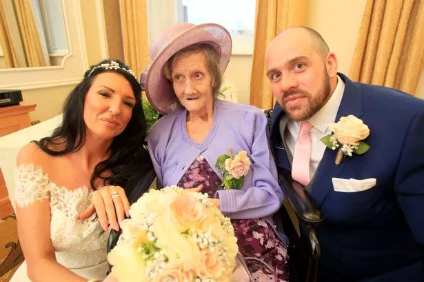 WATCH: Heartwarming moment terminally-ill lady sees her last single son tie the knot in time