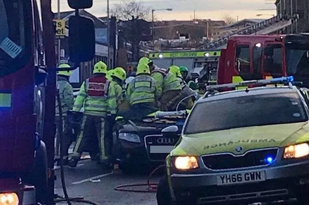 Woman freed from car after serious collision on Huddersfield Road